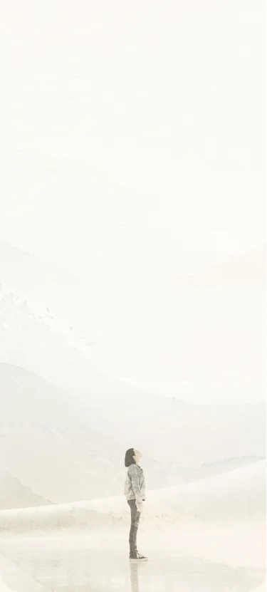 A solitary figure beneath a curved luminous horizon