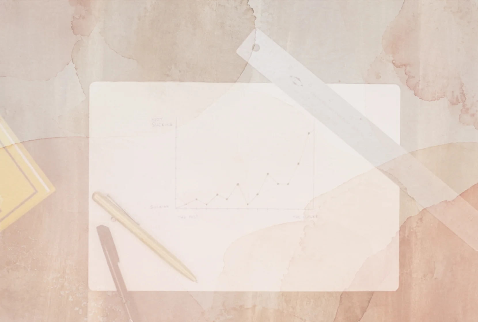An open notebook with a line graph, ruler, and pencils in a textured collage